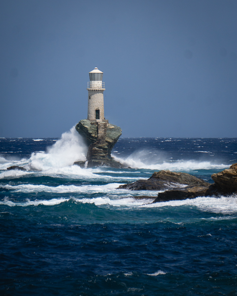 Wave crashing on Tourlitis Lighthouse in Chora Andros