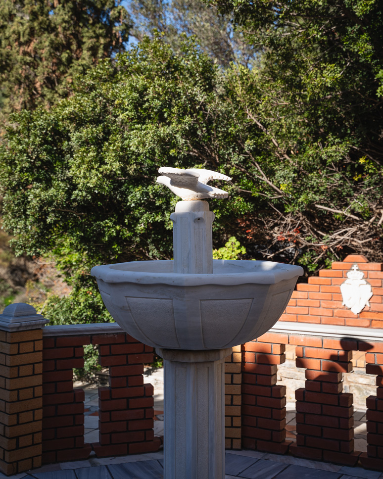 Agios Athanasios Church courtyard fountain dove Syros